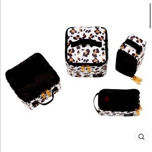 Sold.  Petunia Pickle Bottom packing cubes set of 4 new and unused without tags